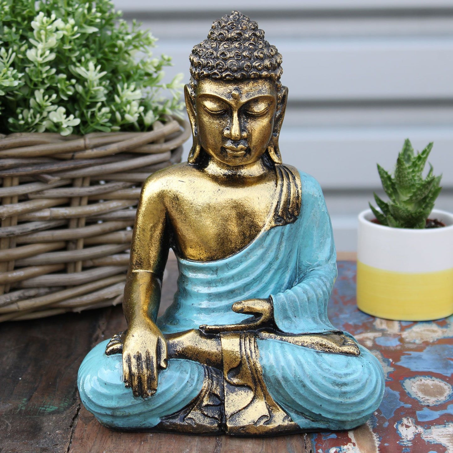 Handbemalte Buddha-Statue in Türkis & Gold - Symbol der inneren Ruhe