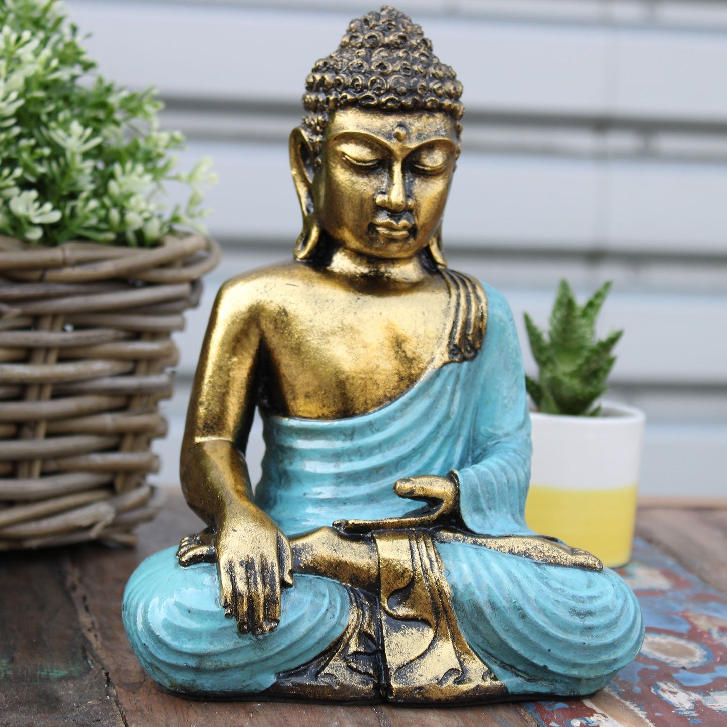 Handbemalte Buddha-Statue in Türkis & Gold - Symbol der inneren Ruhe